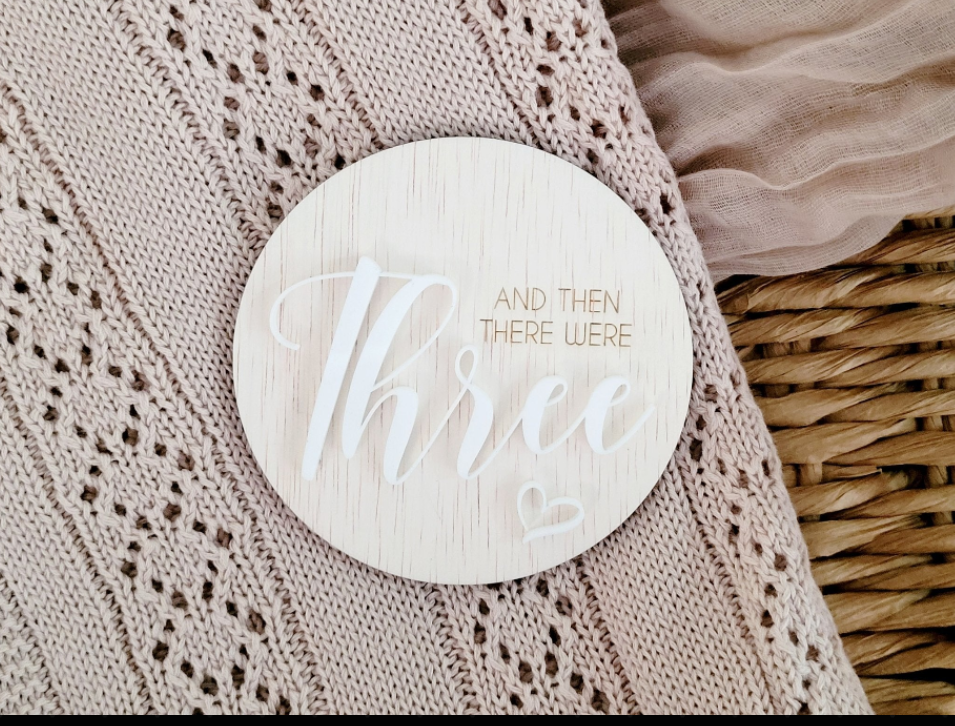 "Then there were three" announcement plaque detail view